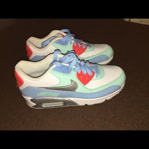 Nike Air Max in red, white, gray, and turquoise.